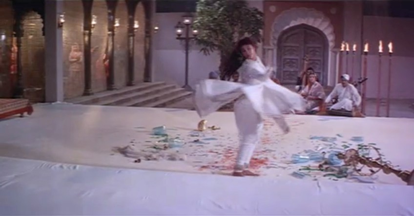 Stunningly beautiful and grotesque, Amrohi captures the twirling of her skirt against the shattered glass.