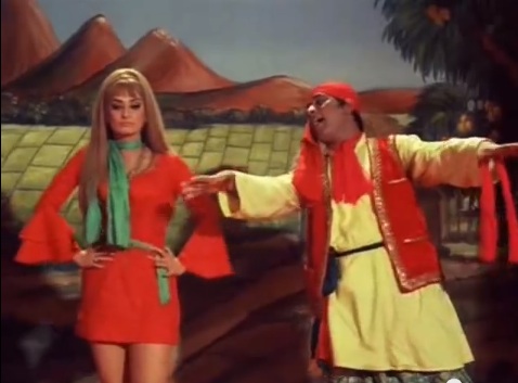 Saira Banu looks on in disgust as Manoj Kumar ruins classic English songs with Panjabi dhamaka in Purab Aur Paschim (1970).
