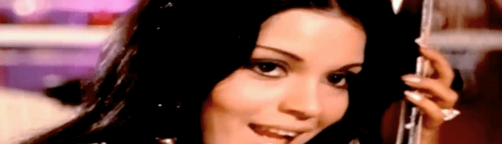 Zeenat Aman pretending to play guitar in Yaadon ki Baraat